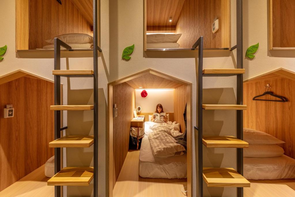 Postel nebo postele na pokoji v ubytování CHO Stay Capsule Hotel-Taoyuan Airport T2