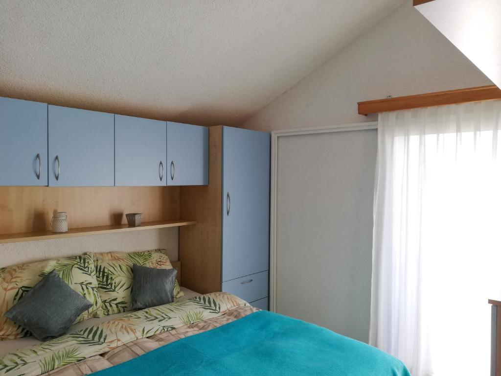 En eller flere senger på et rom på Apartments Branko