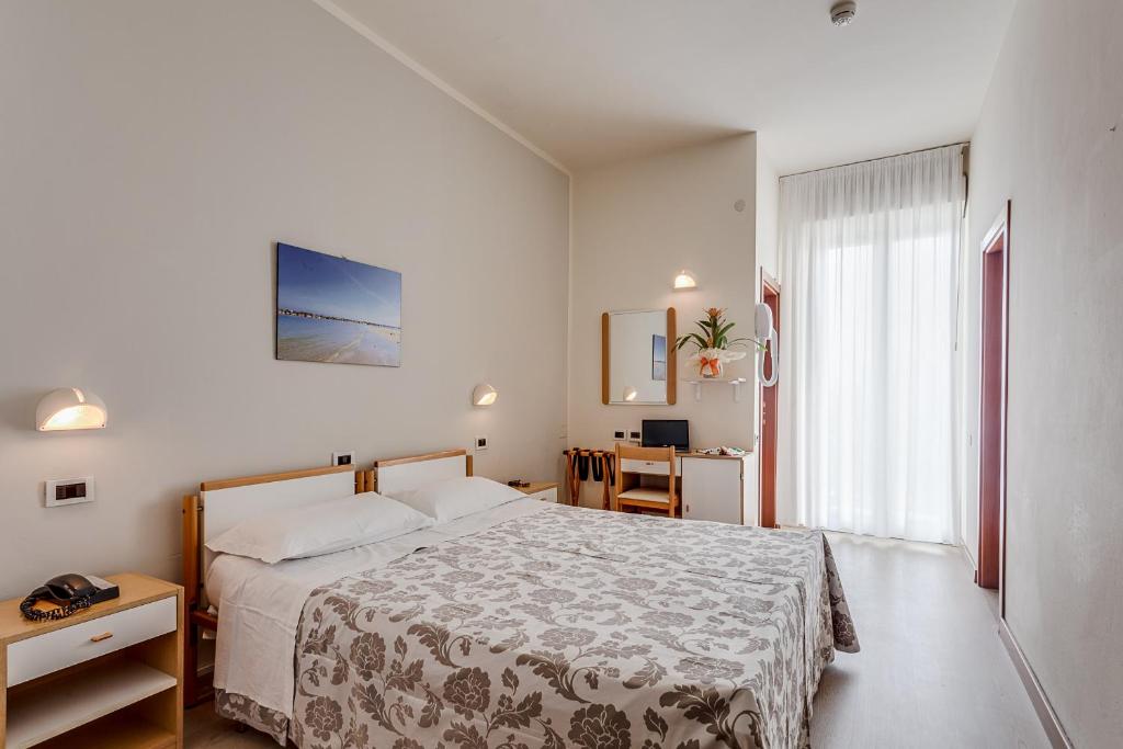 A bed or beds in a room at Hotel San Giorgio