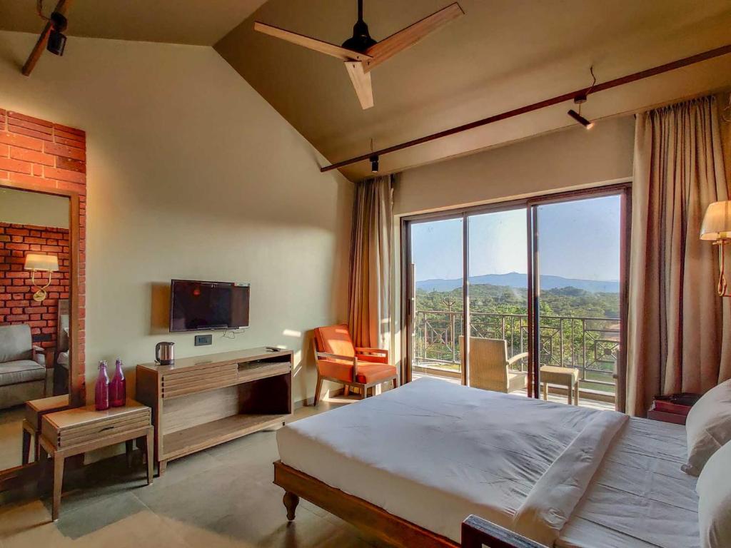 Postel nebo postele na pokoji v ubytování Advait Resort Kshetra Mahabaleshwar