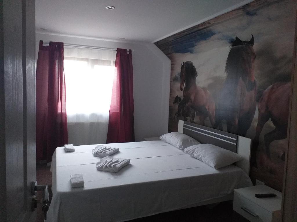Postel nebo postele na pokoji v ubytování Hotel Hobby