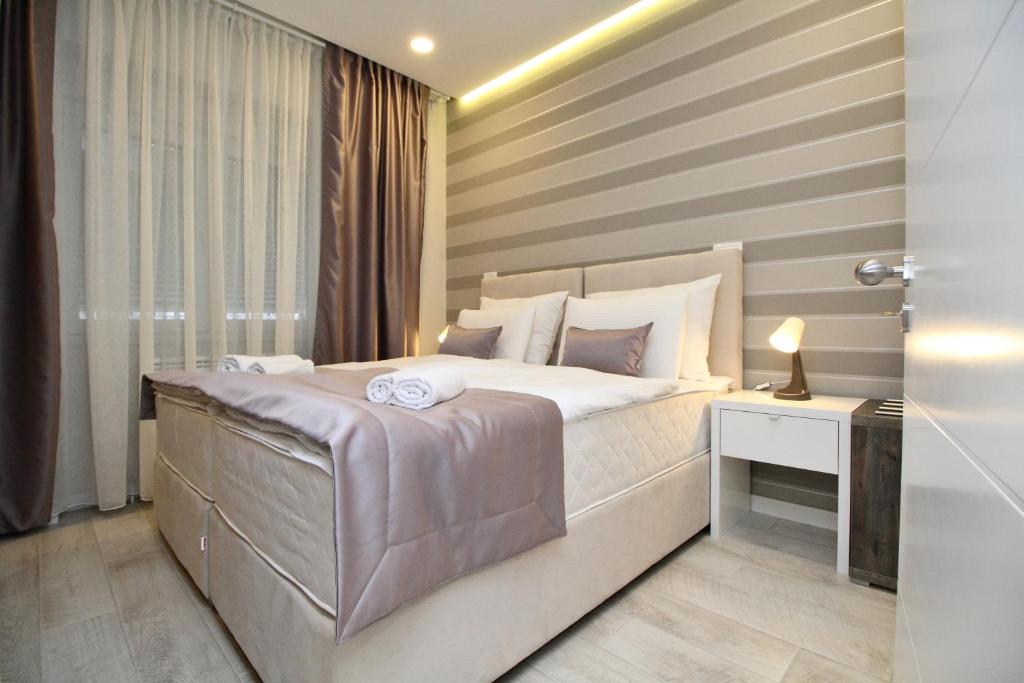 Postel nebo postele na pokoji v ubytování PLATINUM ROOMS butique hotel