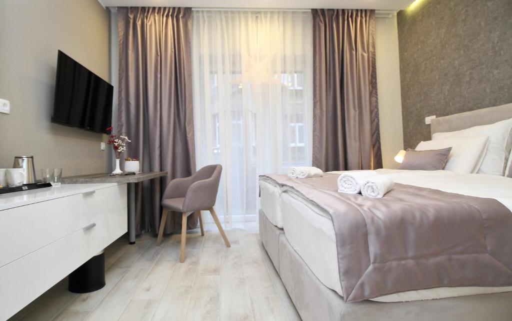 Postel nebo postele na pokoji v ubytování PLATINUM ROOMS butique hotel