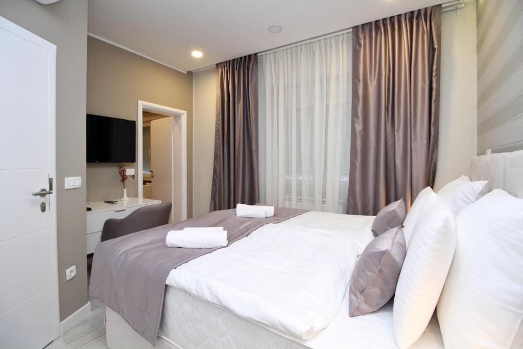 Postel nebo postele na pokoji v ubytování PLATINUM ROOMS butique hotel