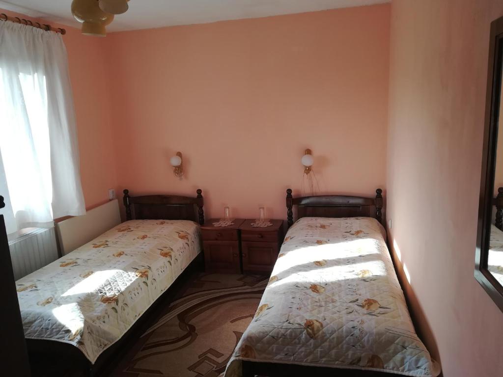 A bed or beds in a room at Guest House Terziiski