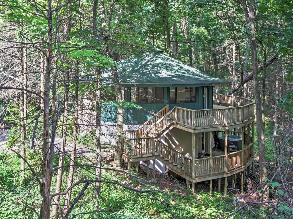 a tree house in the middle of the woods at Unique Gatlinburg Cabin Decks, Hot Tub, Fire Pit in Gatlinburg