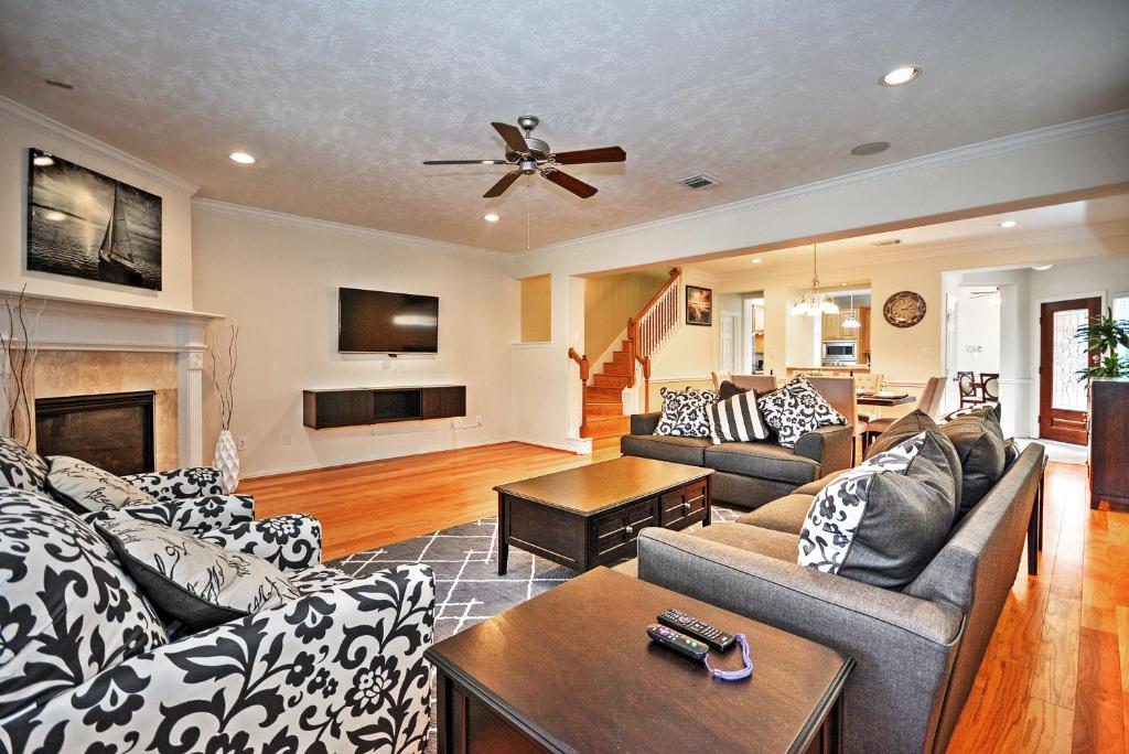 a living room with a couch and a fireplace at 2,500 Sq Ft Townhome - Walk to Central River Oaks! in Houston