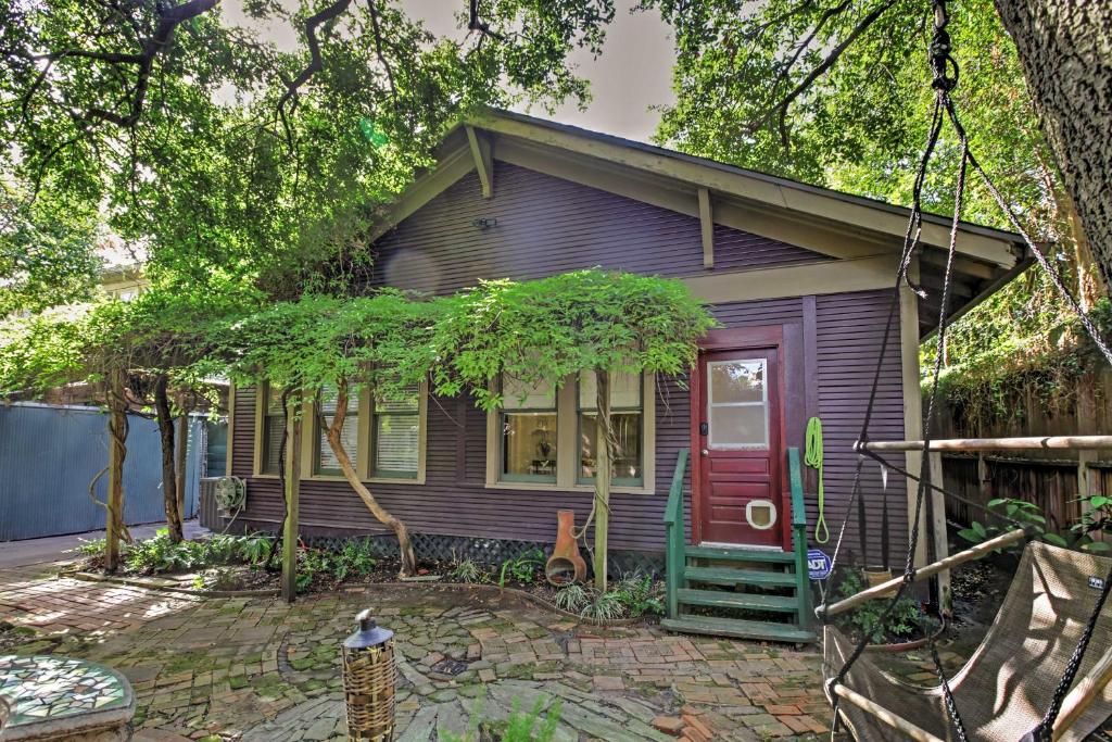 a purple house with a red door at Quaint Houston Hideaway with Yard Less Than 3 Mi to Downtown in Houston