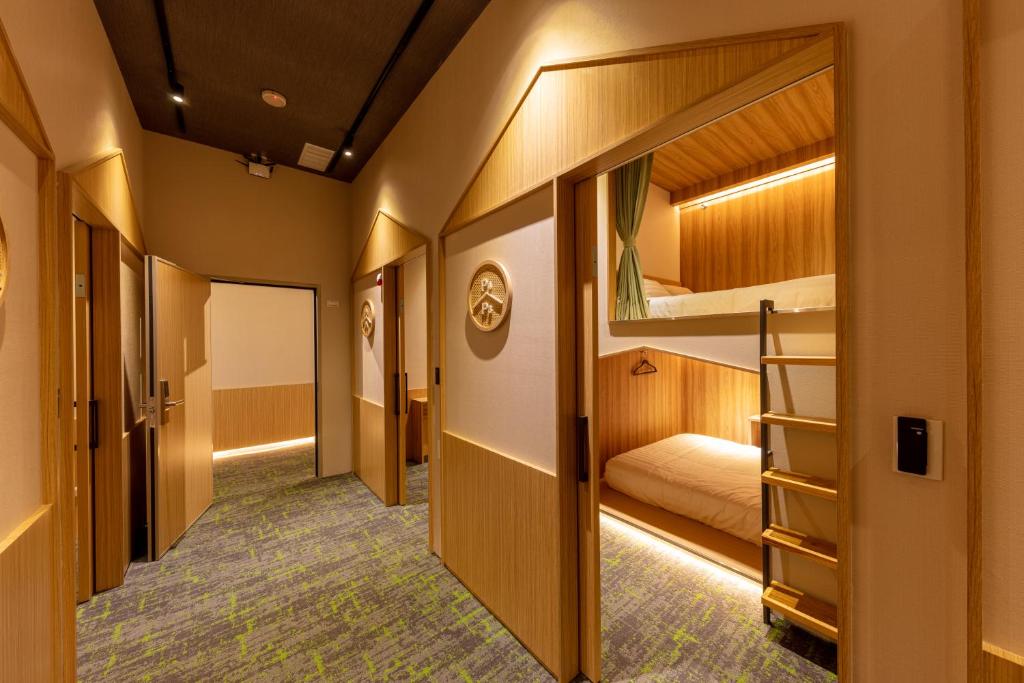 Postel nebo postele na pokoji v ubytování CHO Stay Capsule Hotel-Taoyuan Airport T2