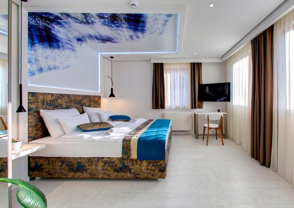 Postel nebo postele na pokoji v ubytování Diamond Rain Boutique Hotel