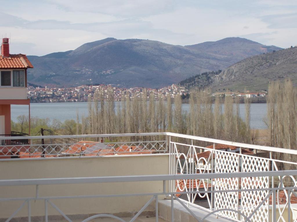 a balcony with a view of a city and a body of water at Dimitra Guesthouse in Kastoria