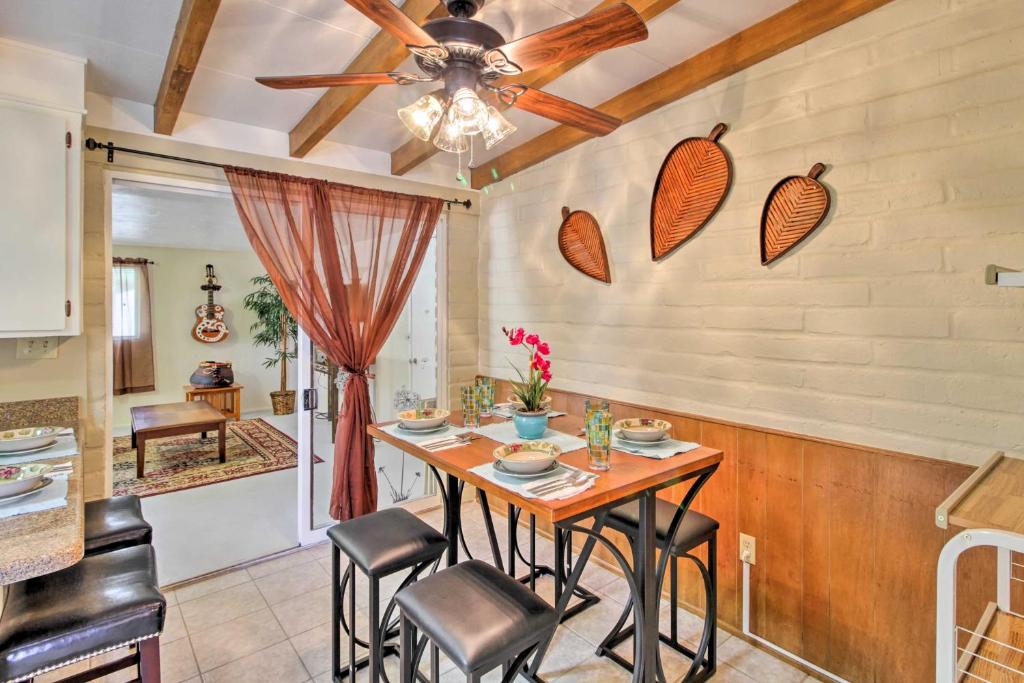 a kitchen with a table with chairs and a ceiling fan at Renovated Tucson Gomez Casita with Yard Less Than 7 Mi to DT in Tucson