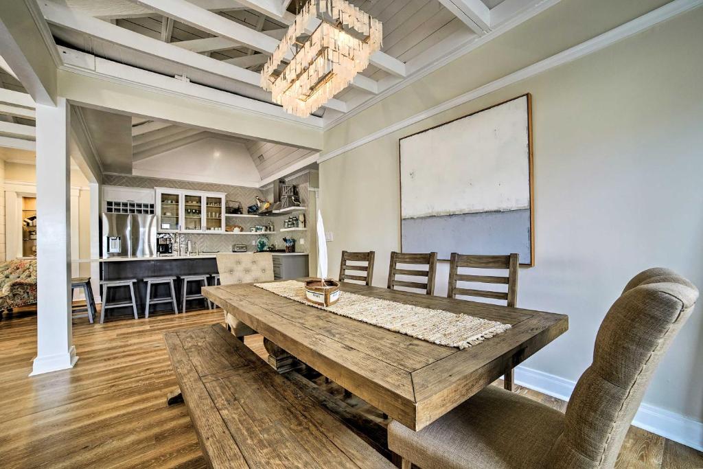 a dining room with a wooden table and chairs at Charming Renovated Avalon Townhome, Walk to Beach! in Avalon