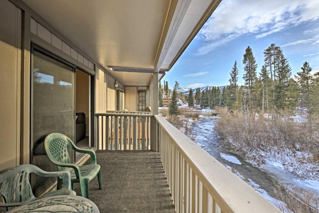 a balcony with two chairs and a view of a river at Winter Park Condo on Bus Route, 2 Blocks to Dtwn! in Winter Park