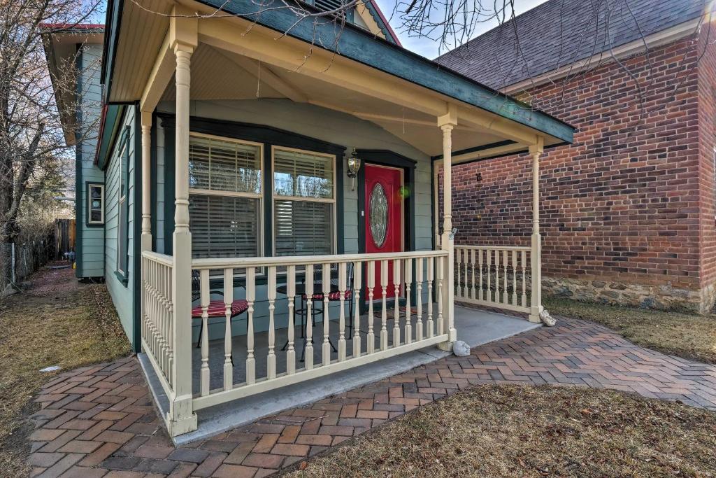 a front porch of a house with a red door at Buena Vista Shambala Sanctuary Near Main St! in Buena Vista