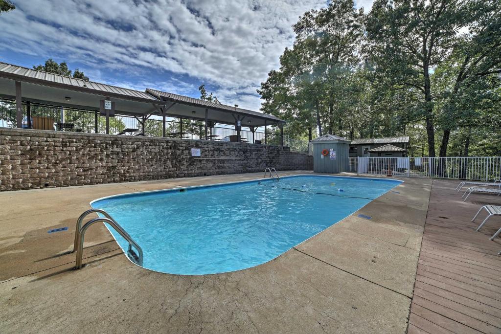 a large swimming pool in the middle of a yard at Branson Condo with Views 2 Mi to Silver Dollar City in Branson West
