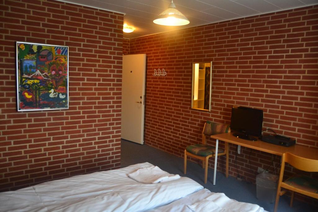 Postel nebo postele na pokoji v ubytování Paarup Kro