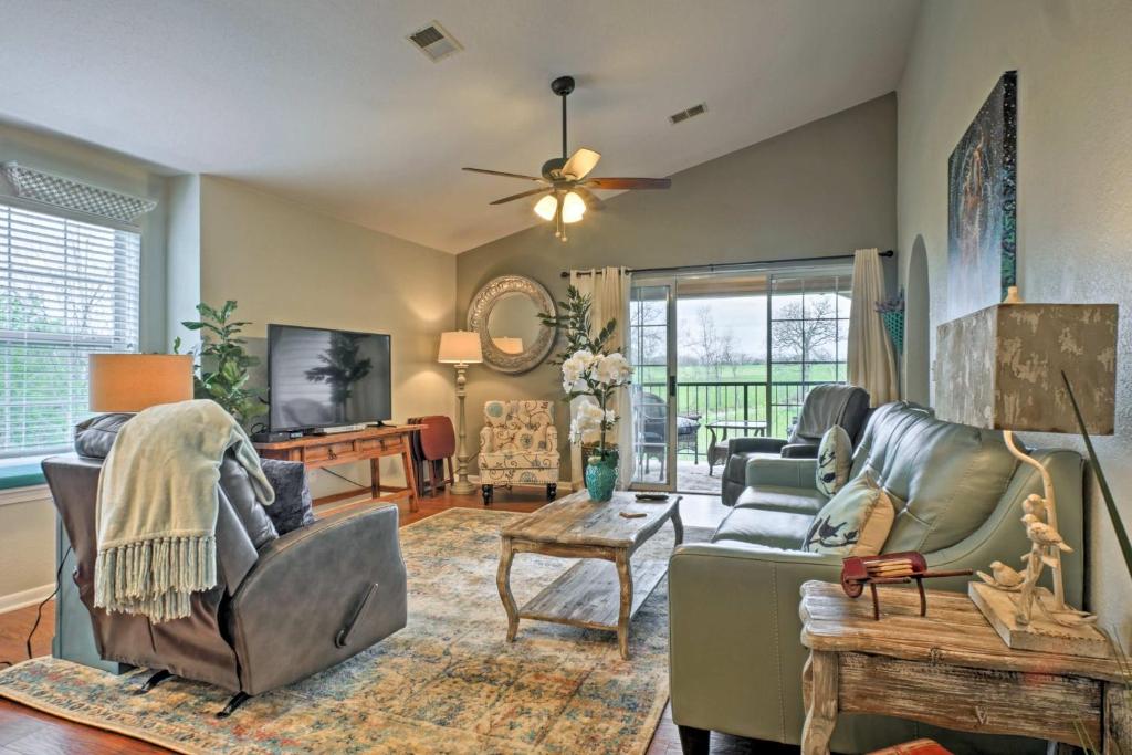 a living room with couches and a tv at Holiday Hills Resort Condo 3 Mi to Branson Strip! in Branson