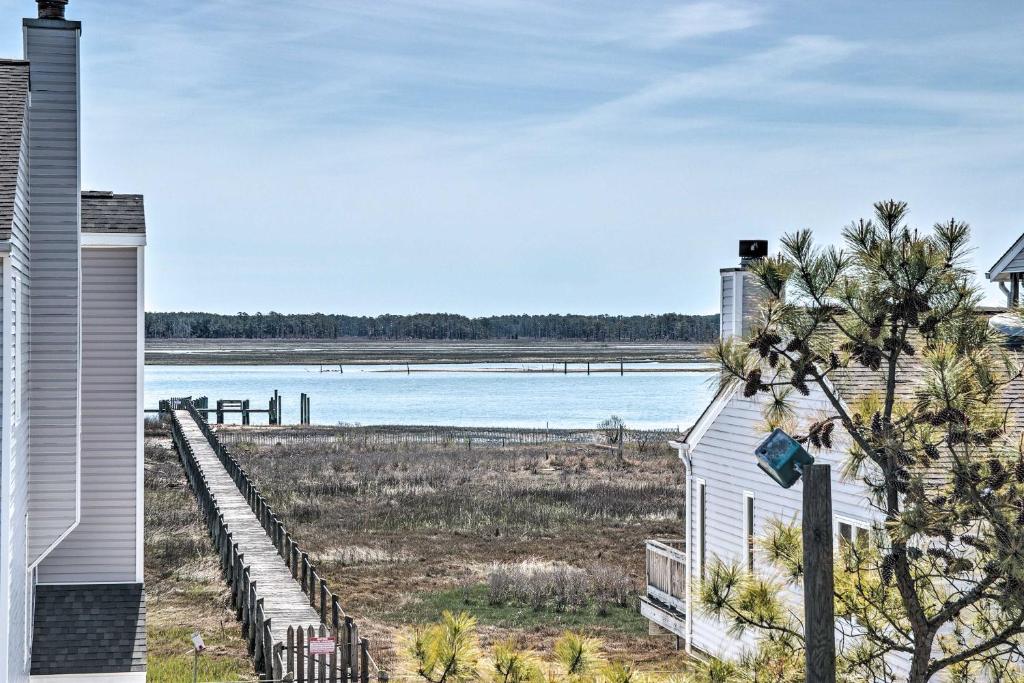 a house with a view of a body of water at Chincoteague Townhome with Pony Views from Deck! in Chincoteague