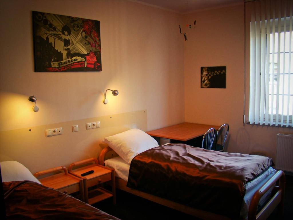 Postel nebo postele na pokoji v ubytování Pentagos