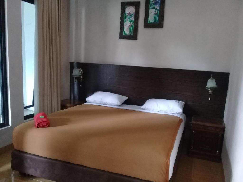 Postel nebo postele na pokoji v ubytování RF Hotel