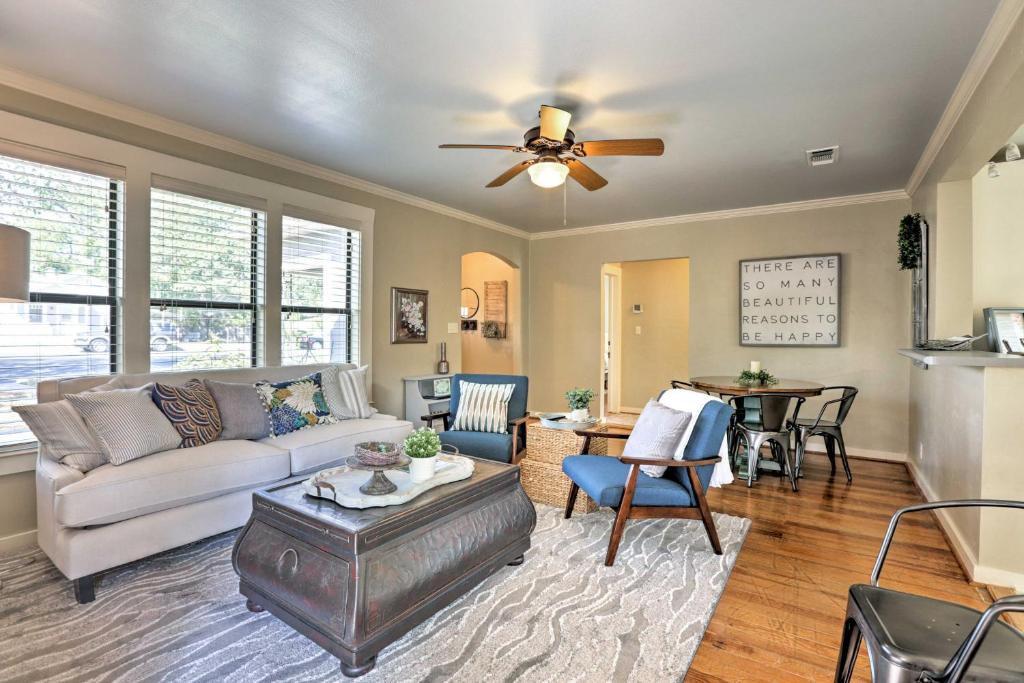 a living room with a couch and a ceiling fan at Fredericksburg Cottage with Grill - Walk to Main St! in Fredericksburg