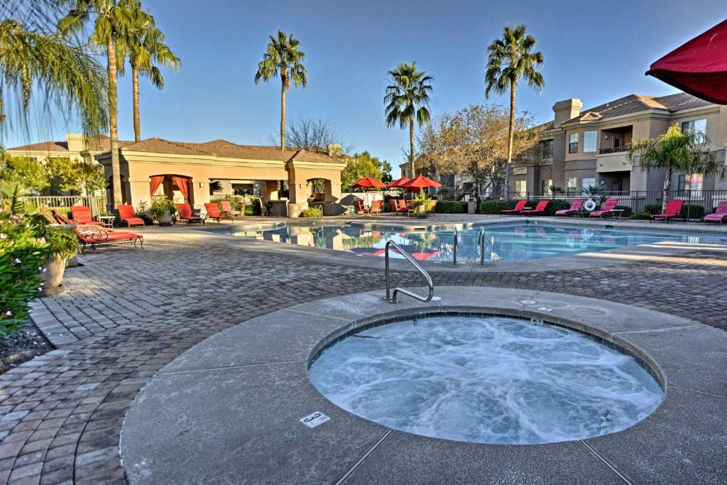 a hot tub in a courtyard next to a swimming pool at Ground-Floor Poolside Mesa Condo with Luxe Amenities in Mesa