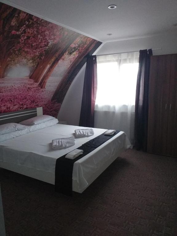 Postel nebo postele na pokoji v ubytování Hotel Hobby