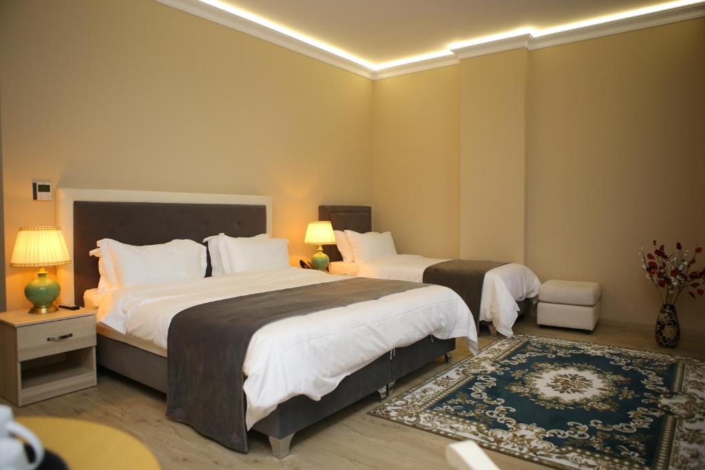Postel nebo postele na pokoji v ubytování Hotel Colombo