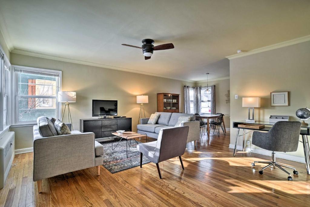 a living room with a couch and a ceiling fan at Townhome with Fast and New WiFi - Walk to Downtown! in Bozeman