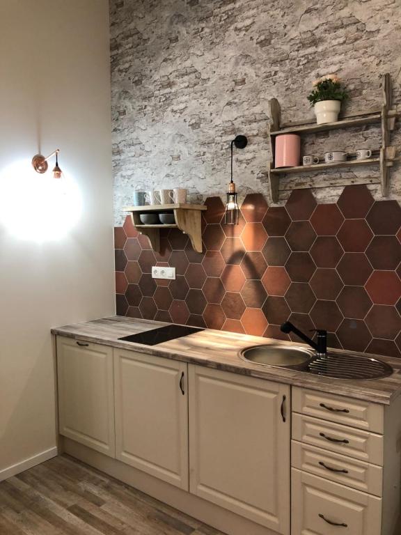 Kuchyňa alebo kuchynka v ubytovaní All In Apartman IV.