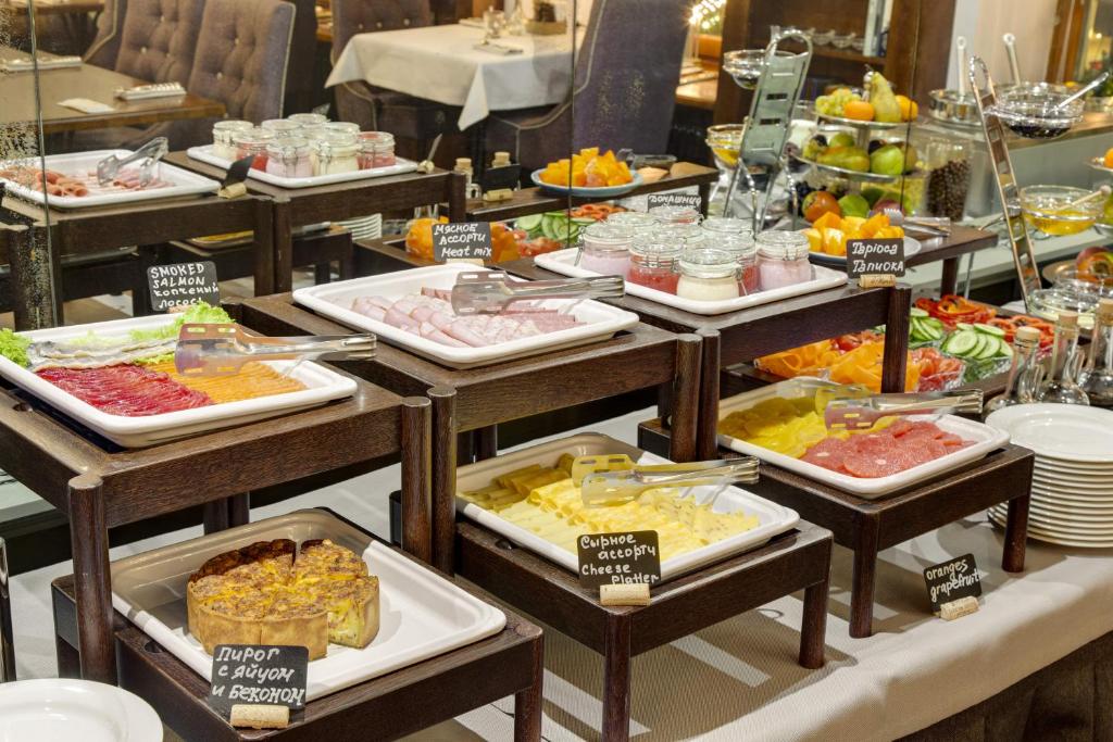 a buffet line with many different types of food at Pushka INN hotel in Saint Petersburg