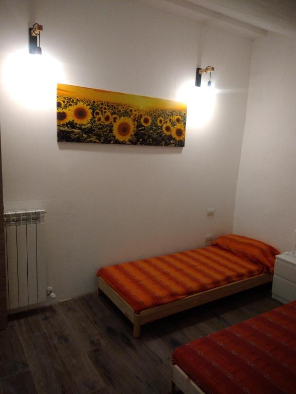 Łóżko lub łóżka w pokoju w obiekcie L'ALPACA DELLA ROSSA - AGRITURISMO