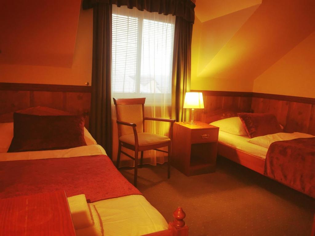 Postelja oz. postelje v sobi nastanitve River Star Hotel