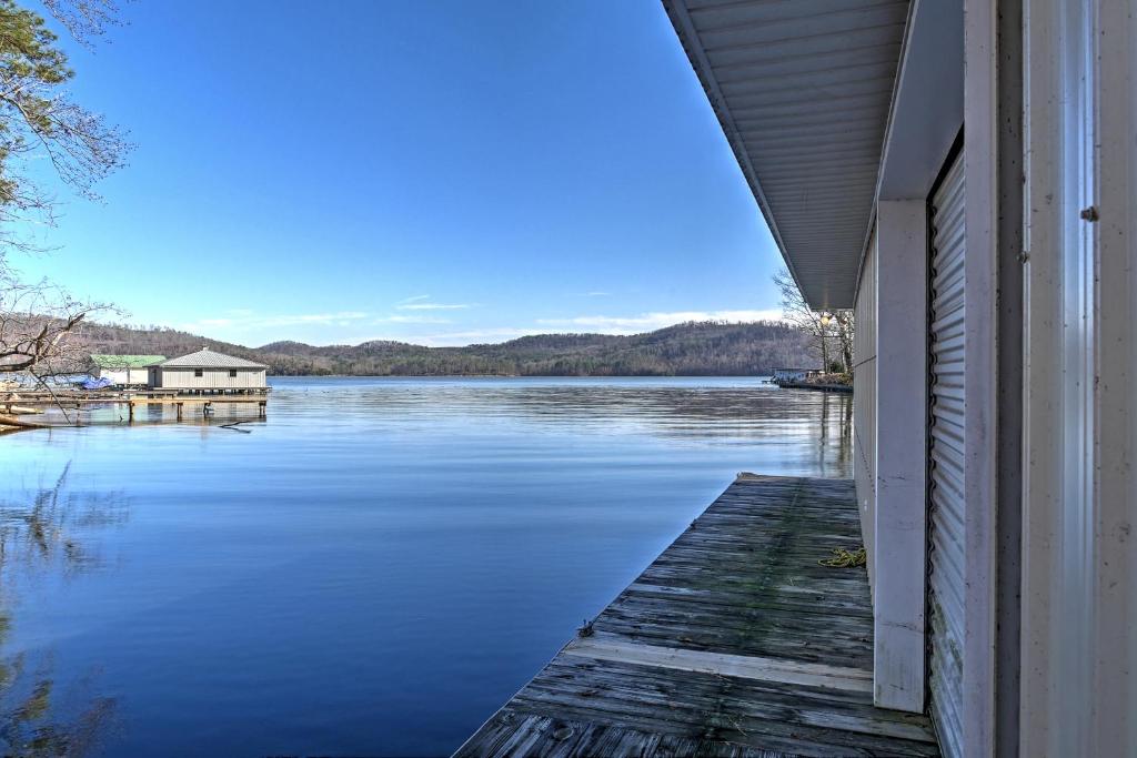 a view of a lake from the side of a house at Paradise Cove Cabin with Boathouse and Dock in Guntersville