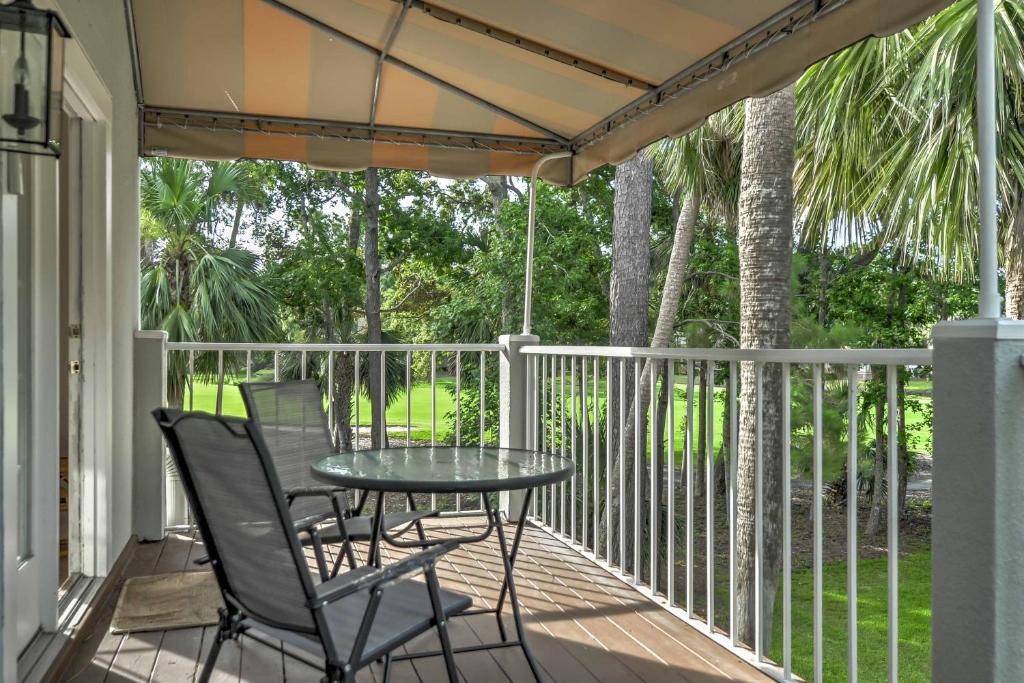 a patio with a table and chairs on a porch at Hilton Head Island Villa On Golf Course! in Hilton Head Island