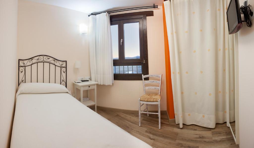 Posteľ alebo postele v izbe v ubytovaní Hotel Valdelinares (Soria)