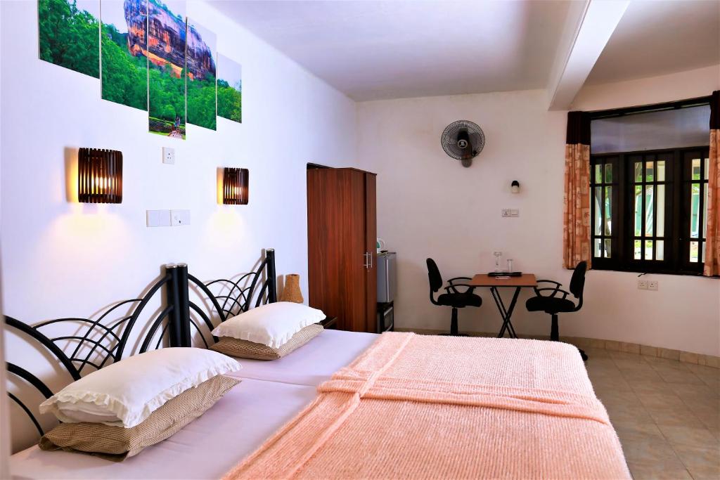 Letto o letti in una camera di Camellia Dwelling