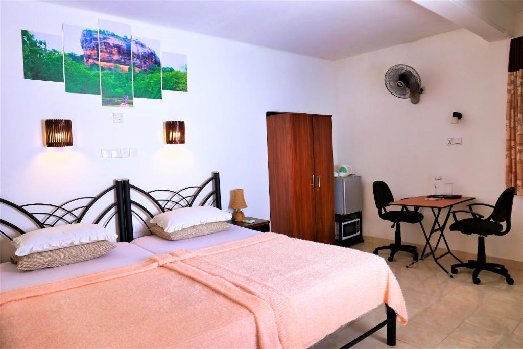 Letto o letti in una camera di Camellia Dwelling