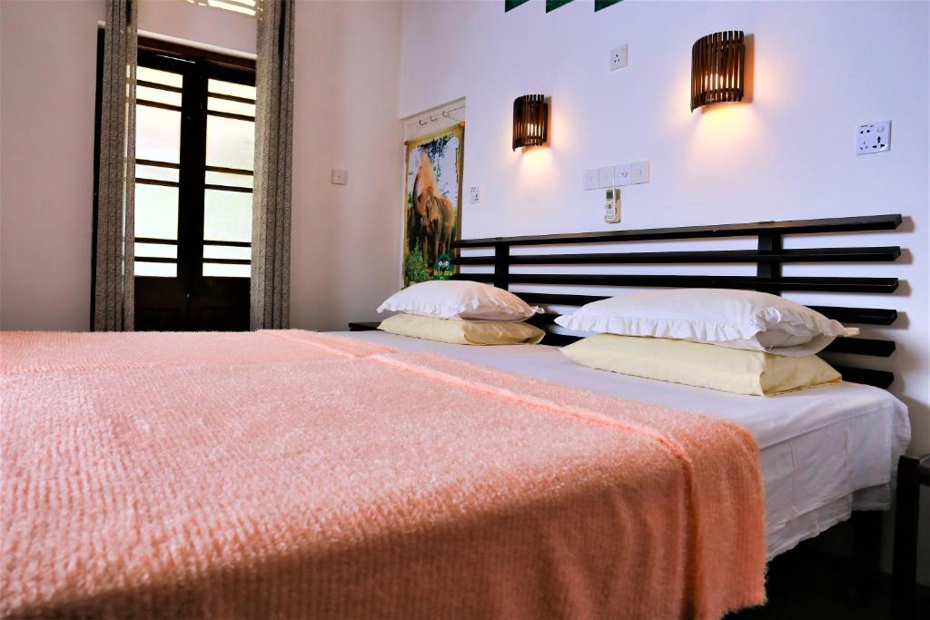 Letto o letti in una camera di Camellia Dwelling