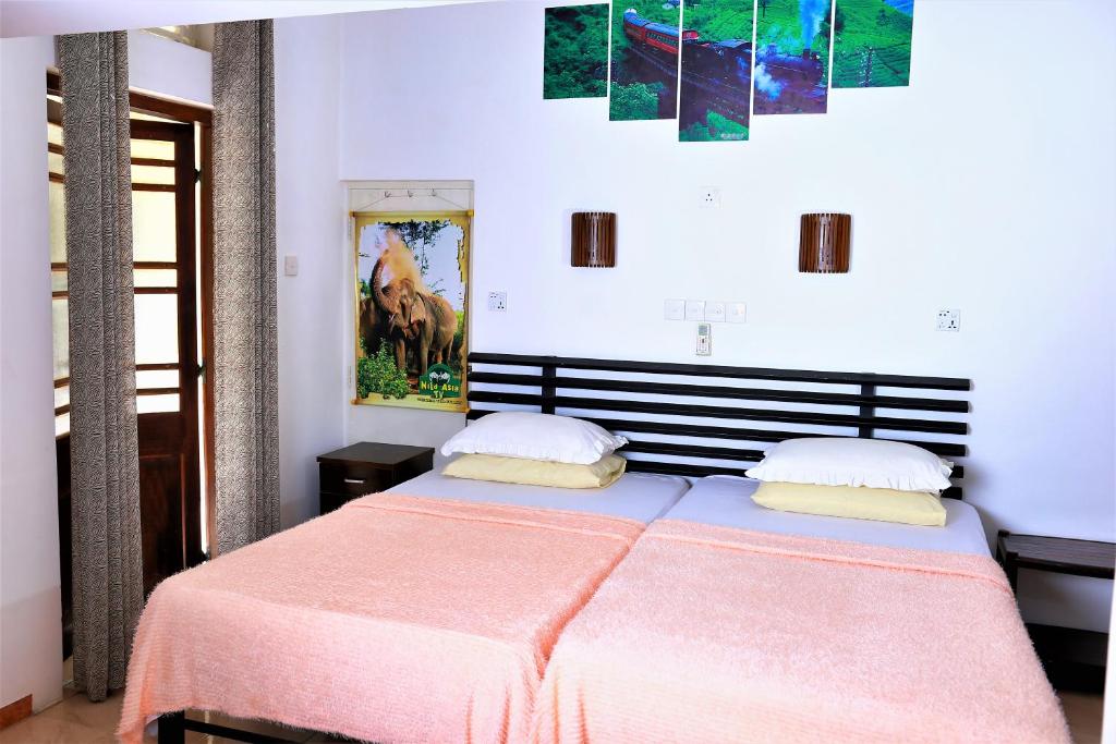 Letto o letti in una camera di Camellia Dwelling