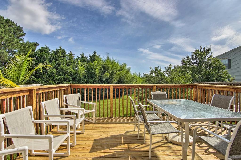 a deck with a table and chairs on it at Pool Access and Deck Bethany Beach Gem in Ocean View