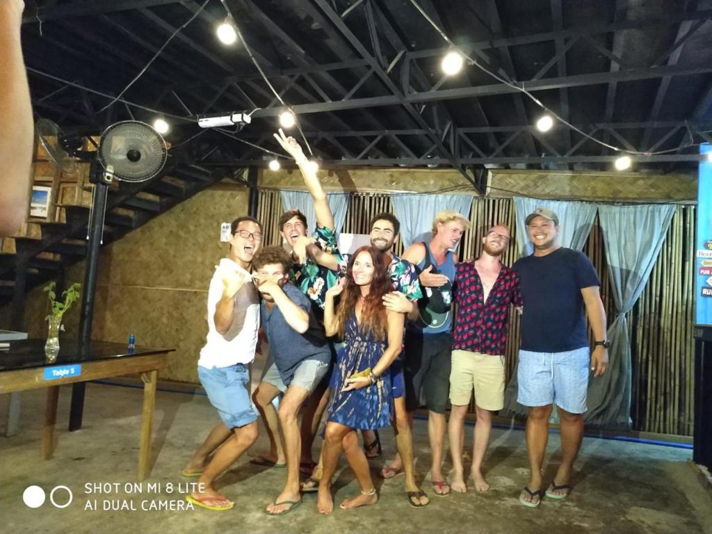 a group of people posing for a picture at Big Paul Hostel in El Nido