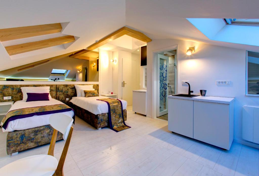 Postel nebo postele na pokoji v ubytování Diamond Rain Boutique Hotel