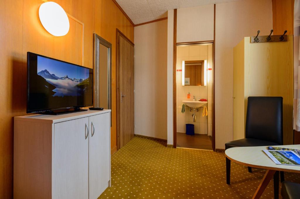 TV a/nebo společenská místnost v ubytování Hotel Bel-Air Eden