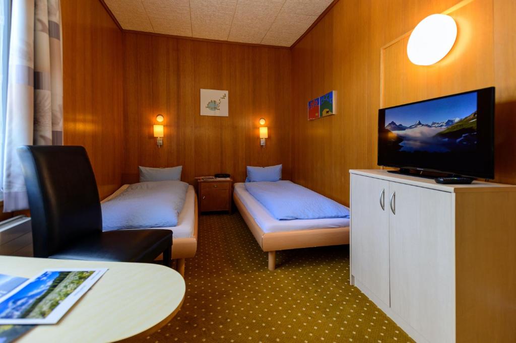 Postel nebo postele na pokoji v ubytování Hotel Bel-Air Eden