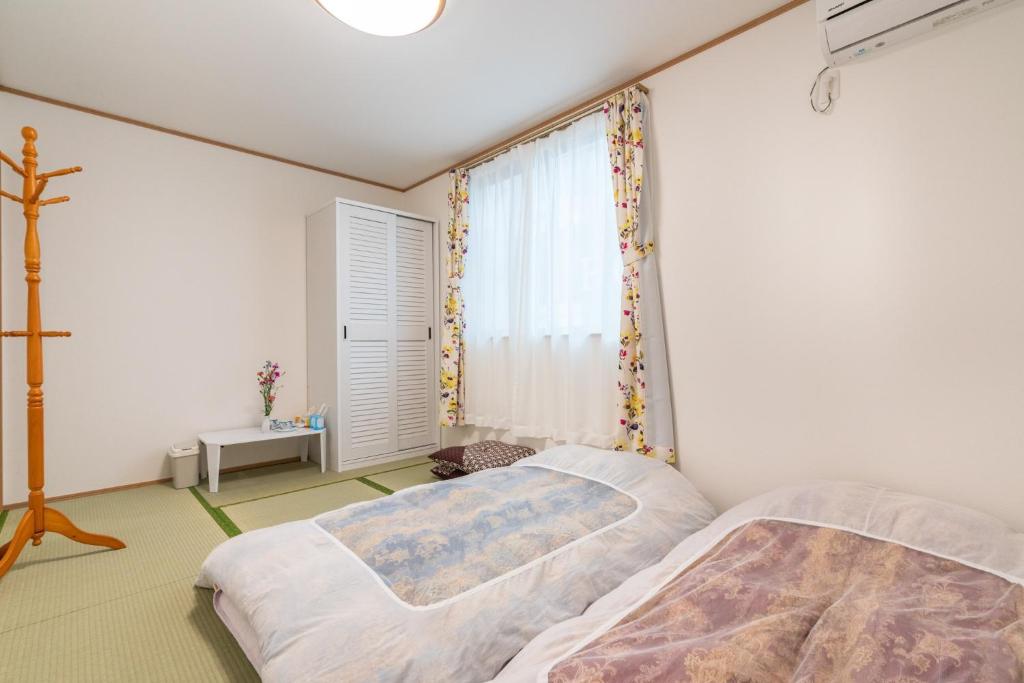 Cama ou camas em um quarto em Travel Palace Miyuki (Yomiuri Shimbun) / Vacation STAY 5730