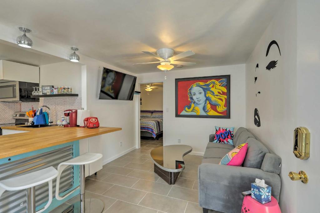 a living room with a couch and a kitchen at Trendy Apt on Route 66 - Near Standin on a Corner in Winslow