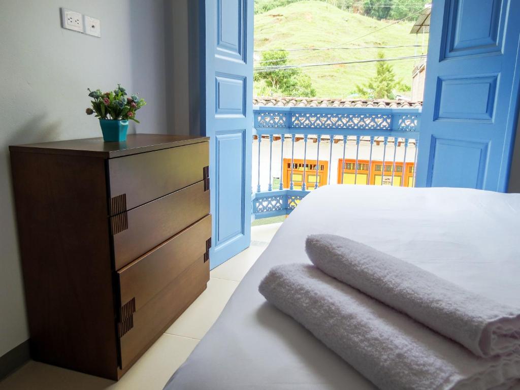 Rúm í herbergi á Hotel Azulado Jericó