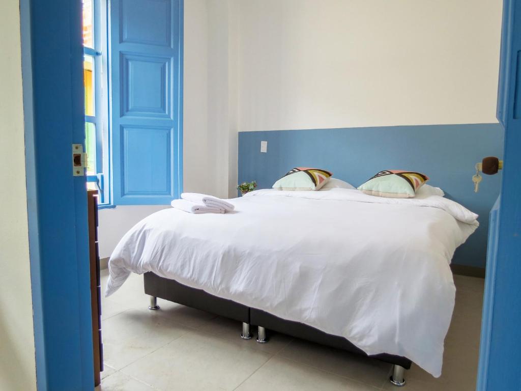 Rúm í herbergi á Hotel Azulado Jericó